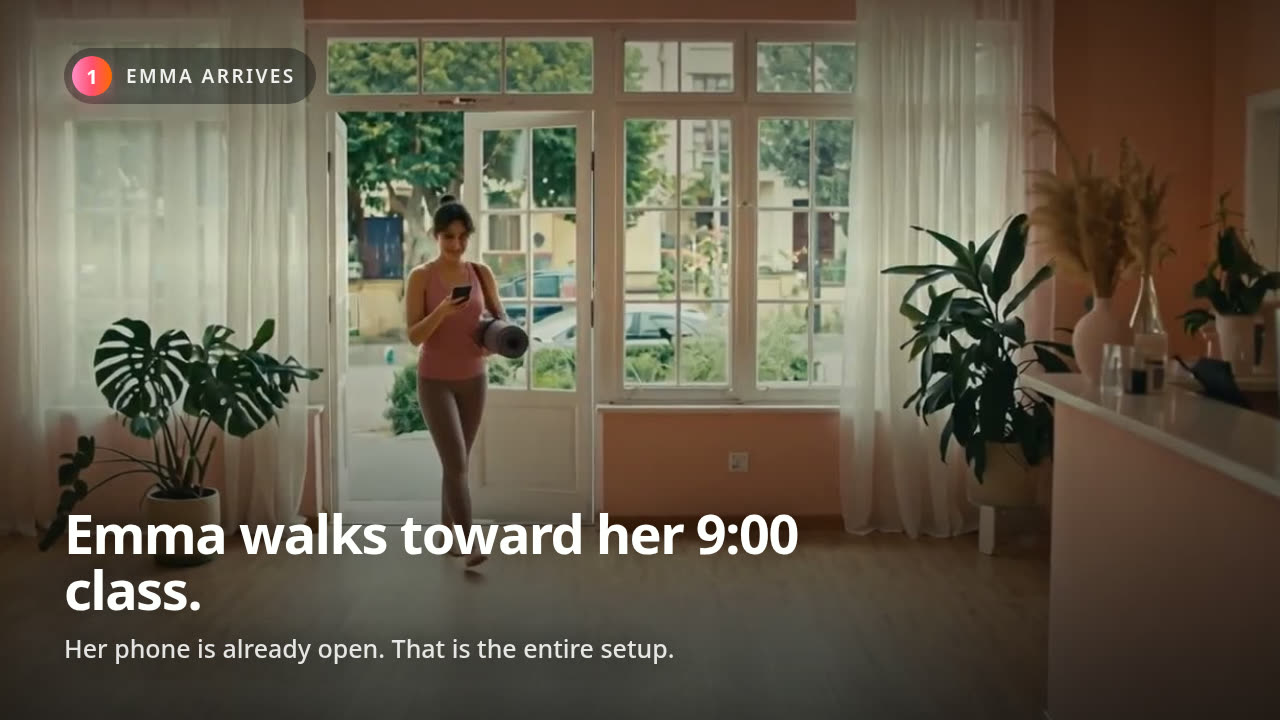 A student walking into a studio as LedBy confirms her check-in