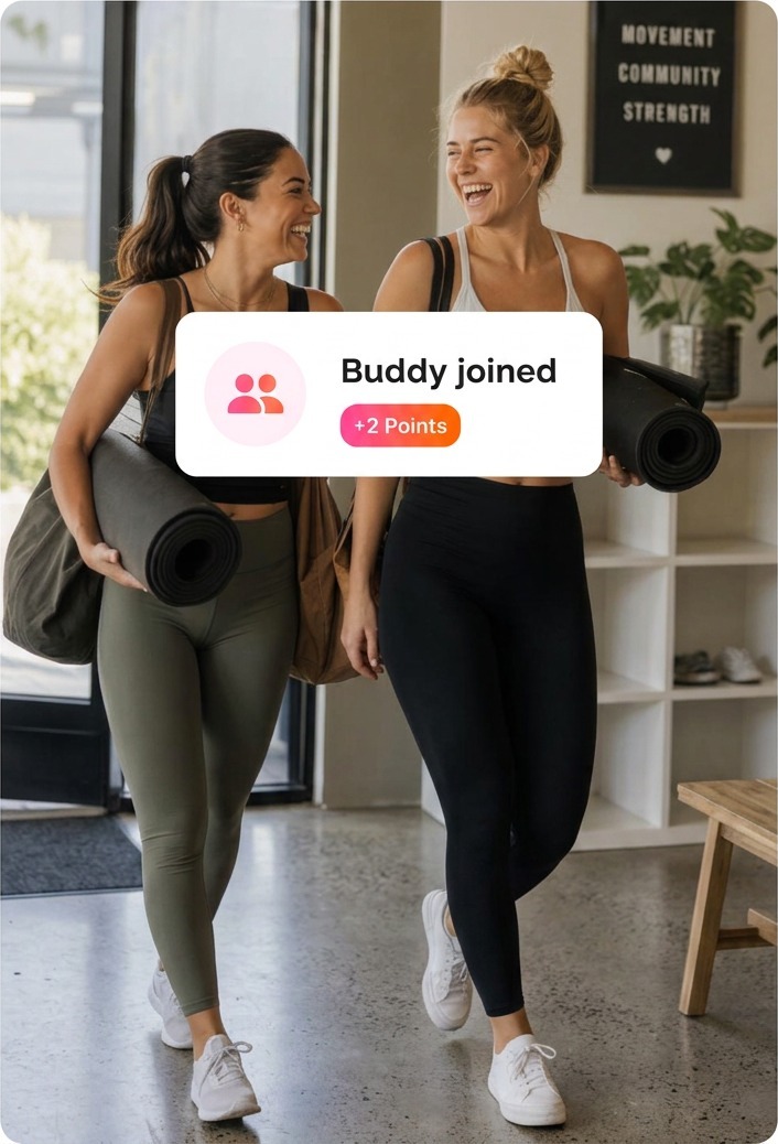 Two friends arriving at a studio together with mats, earning points for bringing a buddy